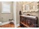 Charming powder room with antique vanity and decorative mirror at 1068 Grant Dr, Denver, NC 28037