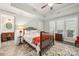 Bedroom featuring access to bathroom, natural light, tray ceiling, ceiling fan and dark tile floor at 1068 Grant Dr, Denver, NC 28037