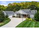 Stunning home with beautiful landscaping, a long driveway and attached two car garage at 1068 Grant Dr, Denver, NC 28037