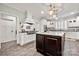 Open kitchen with stainless appliances, custom cabinets, a marble island, and modern pendant lighting at 1068 Grant Dr, Denver, NC 28037