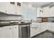 Bright kitchen featuring white cabinets, stainless steel appliances, a farmhouse sink, and natural lighting at 1068 Grant Dr, Denver, NC 28037