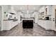 Spacious kitchen with white cabinetry, a large center island, stainless steel appliances, and black countertops at 1068 Grant Dr, Denver, NC 28037