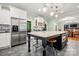 Gourmet kitchen with stainless steel appliances, a marble island, and stylish pendant lighting at 1068 Grant Dr, Denver, NC 28037