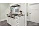 Gourmet kitchen featuring stainless steel appliances, a tile backsplash, and custom white cabinets at 1068 Grant Dr, Denver, NC 28037