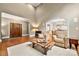 Cozy living room featuring hardwood floors, comfortable seating, and seamless flow to other spaces at 1068 Grant Dr, Denver, NC 28037