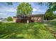 Brick home featuring a screen porch, back deck, and spacious yard at 111 Peoria Ln, Kings Mountain, NC 28086