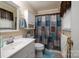 Bathroom with a white vanity, and a shower/tub combo with a colorful curtain at 111 Peoria Ln, Kings Mountain, NC 28086