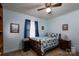 Comfortable bedroom with ceiling fan, carpet flooring and a cozy bed with patterned quilt at 111 Peoria Ln, Kings Mountain, NC 28086