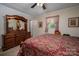 Bedroom showcasing a large dresser with a mirror, a ceiling fan, and neutral walls at 111 Peoria Ln, Kings Mountain, NC 28086