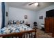 Bedroom featuring carpet flooring, a ceiling fan, and a wood-frame bed with decorative pillows at 111 Peoria Ln, Kings Mountain, NC 28086
