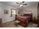 Cozy bedroom with a traditional style bed, side tables, and carpet flooring at 111 Peoria Ln, Kings Mountain, NC 28086