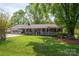 Beautiful single-story brick house with a well-manicured lawn and covered parking at 111 Peoria Ln, Kings Mountain, NC 28086