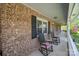 Covered brick porch featuring rocking chairs at 111 Peoria Ln, Kings Mountain, NC 28086
