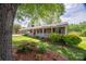 Charming single-story home with a brick facade, landscaped front yard and a covered porch at 111 Peoria Ln, Kings Mountain, NC 28086