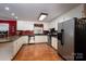 Functional kitchen with stainless steel appliances, granite countertops, and hardwood floors at 111 Peoria Ln, Kings Mountain, NC 28086