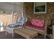 Cozy screened porch with comfortable wicker seating, perfect for relaxing and enjoying the outdoors at 111 Peoria Ln, Kings Mountain, NC 28086