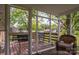 Relaxing screened porch with outdoor seating, providing a seamless transition between indoor and outdoor living spaces at 111 Peoria Ln, Kings Mountain, NC 28086