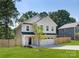 Well-maintained two-story home with a fresh lawn and a privacy fence, perfect for outdoor enjoyment at 1141 Thayer Glen Ct, Charlotte, NC 28213
