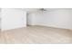 Spacious and bright living room with light wood-look flooring and neutral tones at 1141 Thayer Glen Ct, Charlotte, NC 28213