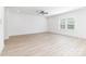 Bright living area with light wood-look flooring and large window for natural light at 1141 Thayer Glen Ct, Charlotte, NC 28213