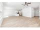 Spacious living area featuring hardwood floors, an open layout, and modern lighting at 1141 Thayer Glen Ct, Charlotte, NC 28213