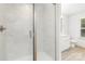 Main bathroom featuring a glass shower, with tile surround, and updated vanity at 1141 Thayer Glen Ct, Charlotte, NC 28213