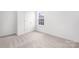 Bright bedroom featuring neutral carpet, a double-door closet, and a window for natural light at 1144 Thayer Glen Ct, Charlotte, NC 28213