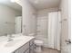 This bathroom includes a shower-tub, a vanity with sink, a toilet and mirror at 12214 Ardrey Park Dr, Charlotte, NC 28277