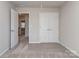 This bedroom has a view into the hallway and features a double door closet at 12214 Ardrey Park Dr, Charlotte, NC 28277