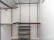 This walk-in closet includes adjustable shelving and drawers for customized organization at 12214 Ardrey Park Dr, Charlotte, NC 28277
