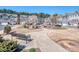 View of a community space with landscaping, sidewalks, seating, and fire pit near attractive townhome-style condos at 12214 Ardrey Park Dr, Charlotte, NC 28277