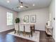 Dining room features a wooden table, large window, and hardwood floors at 12214 Ardrey Park Dr, Charlotte, NC 28277