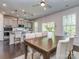 Bright dining room showcasing an open-concept to a well-equipped kitchen at 12214 Ardrey Park Dr, Charlotte, NC 28277