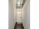 Bright foyer featuring wood floors, a white door, and an open staircase to the second floor at 12214 Ardrey Park Dr, Charlotte, NC 28277