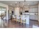 This spacious kitchen features stainless steel appliances, a large island with bar seating, and stylish pendant lighting at 12214 Ardrey Park Dr, Charlotte, NC 28277