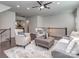 Relaxing living area with hardwood floors, a fan, and comfortable furniture at 12214 Ardrey Park Dr, Charlotte, NC 28277