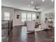 Spacious living area boasts hardwood floors, a ceiling fan, and lots of natural light at 12214 Ardrey Park Dr, Charlotte, NC 28277