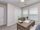 This office features a ceiling fan, 2 large windows for natural light, and a desk at 12214 Ardrey Park Dr, Charlotte, NC 28277