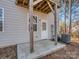 Back patio with a door, exposed beams and an air conditioning unit at 12214 Ardrey Park Dr, Charlotte, NC 28277