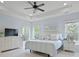 This main bedroom features light blue walls, white furniture, and multiple windows with natural light at 13115 Union Square Dr, Huntersville, NC 28078
