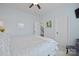 Light-filled bedroom featuring an inviting bed, neutral walls, and access to other areas of the home at 13115 Union Square Dr, Huntersville, NC 28078