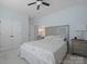 Comfortable bedroom with soft carpet, a ceiling fan, and a cozy bed with matching nightstands at 13115 Union Square Dr, Huntersville, NC 28078