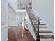 Grand foyer with hardwood floors, elegant staircase, and an open, airy design at 13115 Union Square Dr, Huntersville, NC 28078