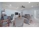 Spacious living room with ceiling fan, comfortable seating, and plenty of room for relaxation and entertainment at 13115 Union Square Dr, Huntersville, NC 28078
