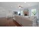 Inviting living room with hardwood floors, a cozy sofa, and a brick fireplace, perfect for relaxing at 13115 Union Square Dr, Huntersville, NC 28078