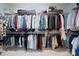 A spacious walk-in closet with shelving and hanging rods, providing ample storage for clothes and accessories at 13115 Union Square Dr, Huntersville, NC 28078