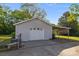 Detached garage with a pull through and attached carport on a sunny day at 1321 South Point Rd, Belmont, NC 28012