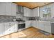 Bright kitchen with white cabinets, stainless steel appliances, and a window over the sink at 1321 South Point Rd, Belmont, NC 28012