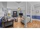 Bright living room featuring hardwood floors, fireplace, and a comfortable seating area at 1321 South Point Rd, Belmont, NC 28012