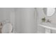 Clean half bathroom showcasing a toilet, sink, mirror, and light neutral decor at 1390 Cedardale Ln, Denver, NC 28037
